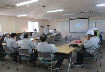Scene from a BCP drill: Personnel at the emergency headquarters gathering and assessing the latest situation.